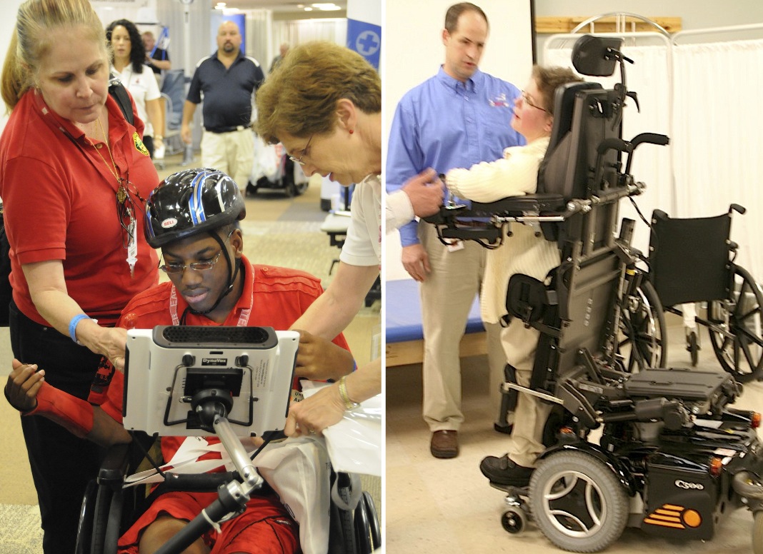Two people are introduced to their new wheelchairs. A young man in shown how to work the touch screen attached to his wheelchair. A woman is shown how to bring her wheelchair into a standing position.  